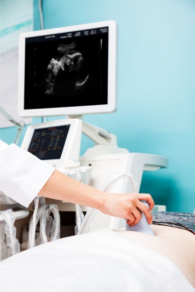 Woman undergoing an ultrasound at a doctor's office