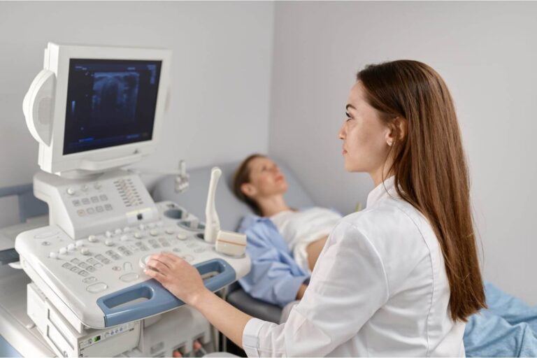 pregnant woman undergoing an ultrasound at a pregnancy clinic