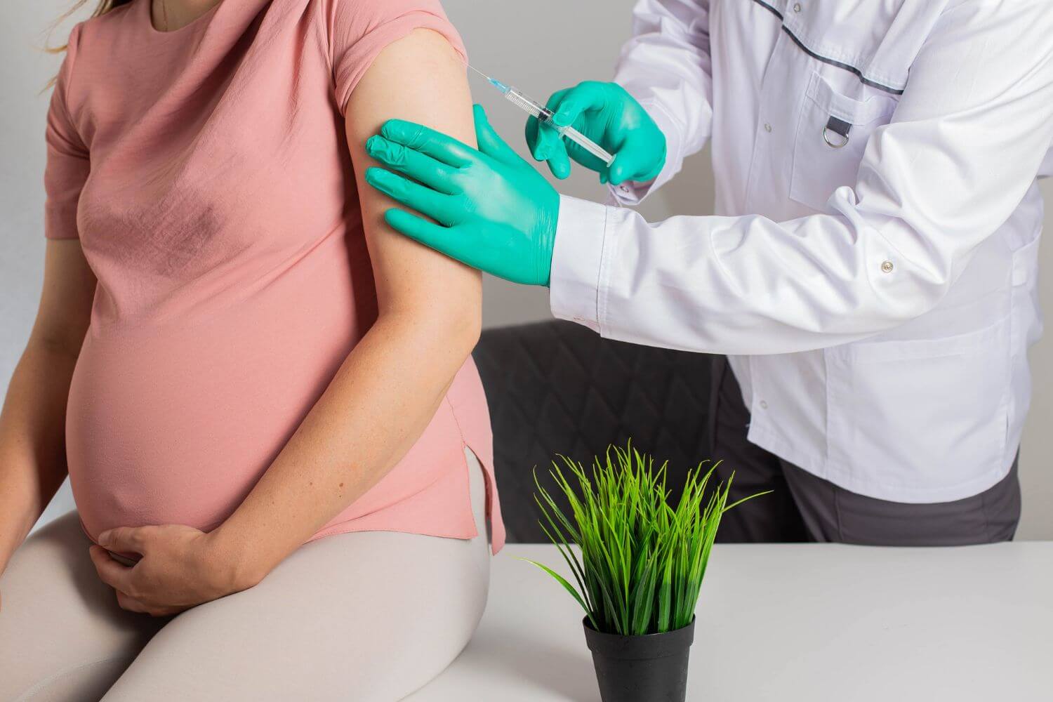 Doctor administering an Rh shot to a pregnant woman