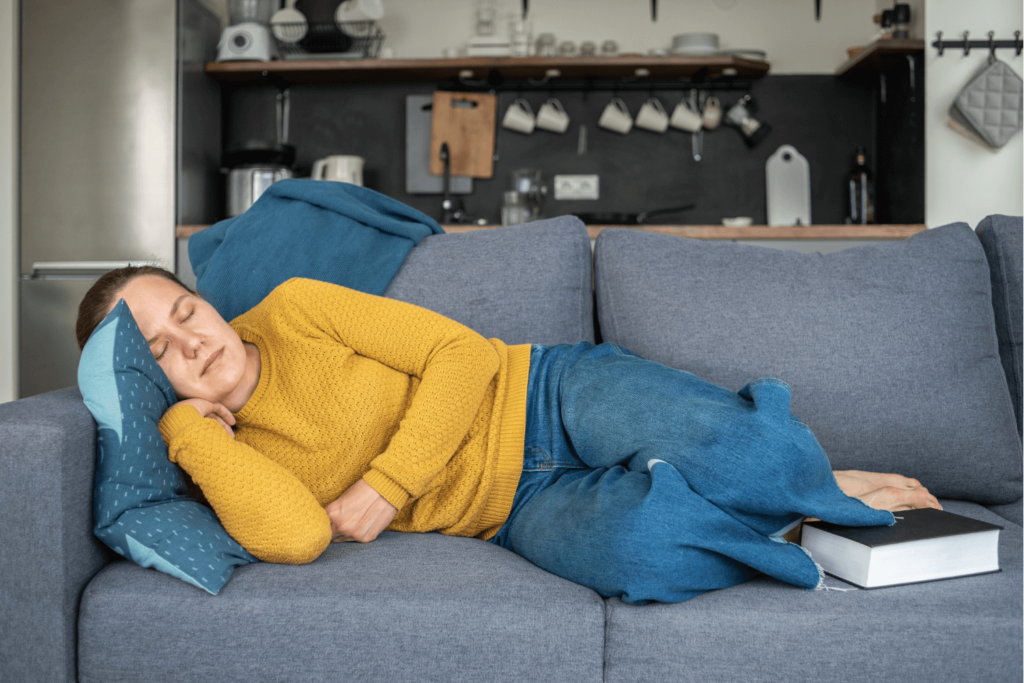 Fatigued woman taking a nap on the couch