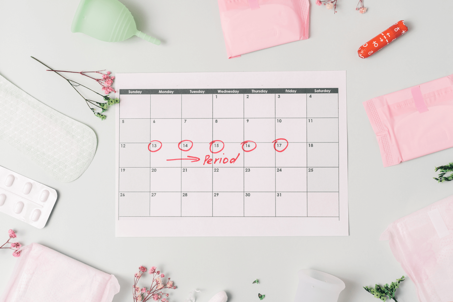 paper calendar showing menstrual cycle tracking
