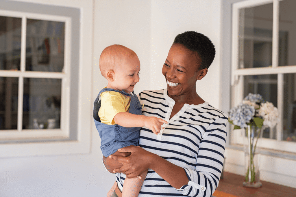 Adoptive mother holding her baby
