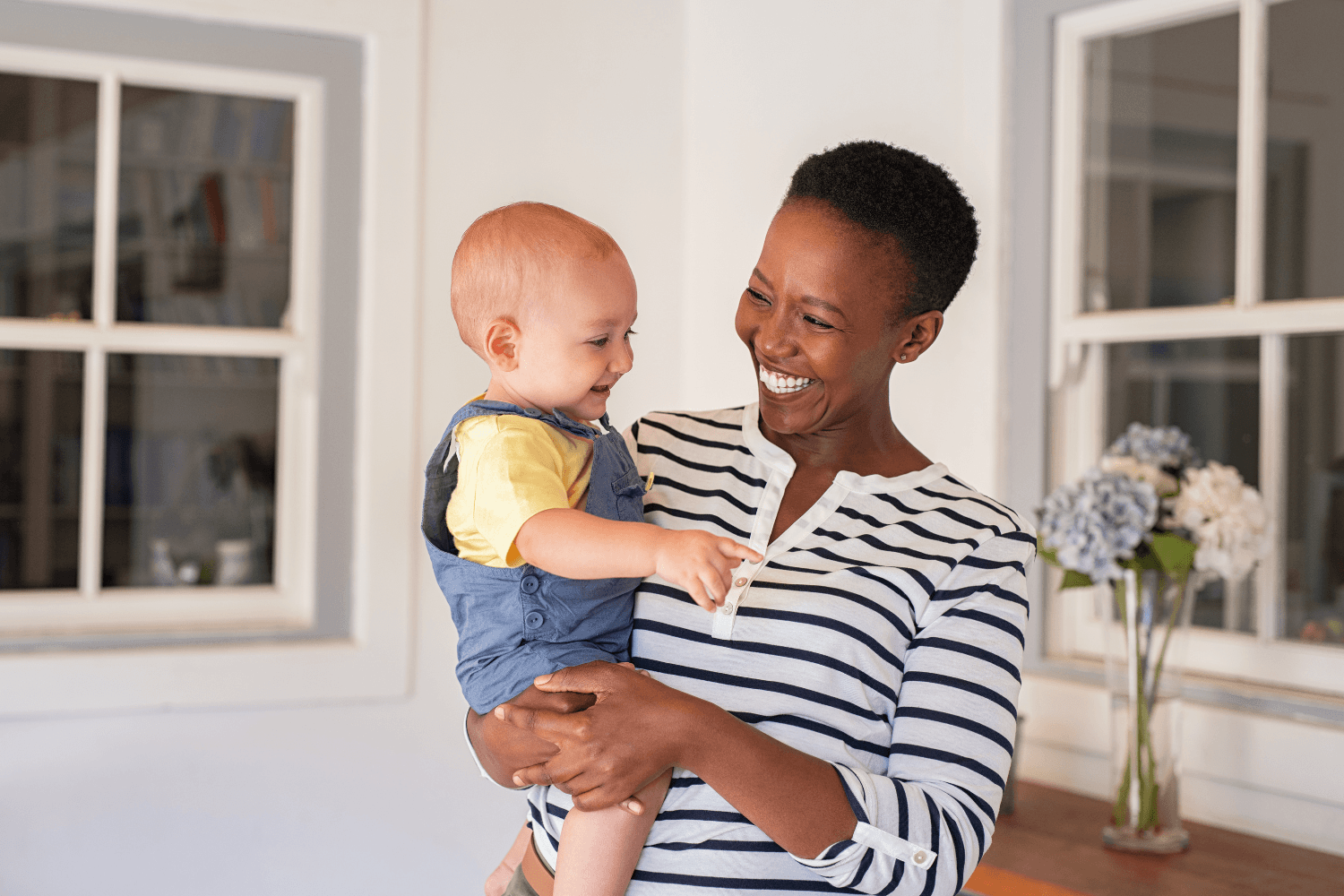 Adoptive mother holding her baby