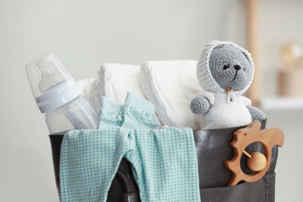 Collection of essential newborn supplies in a grey basket