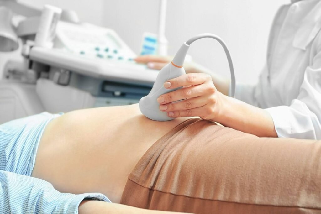 Pregnant woman receiving an ultrasound at a clinic