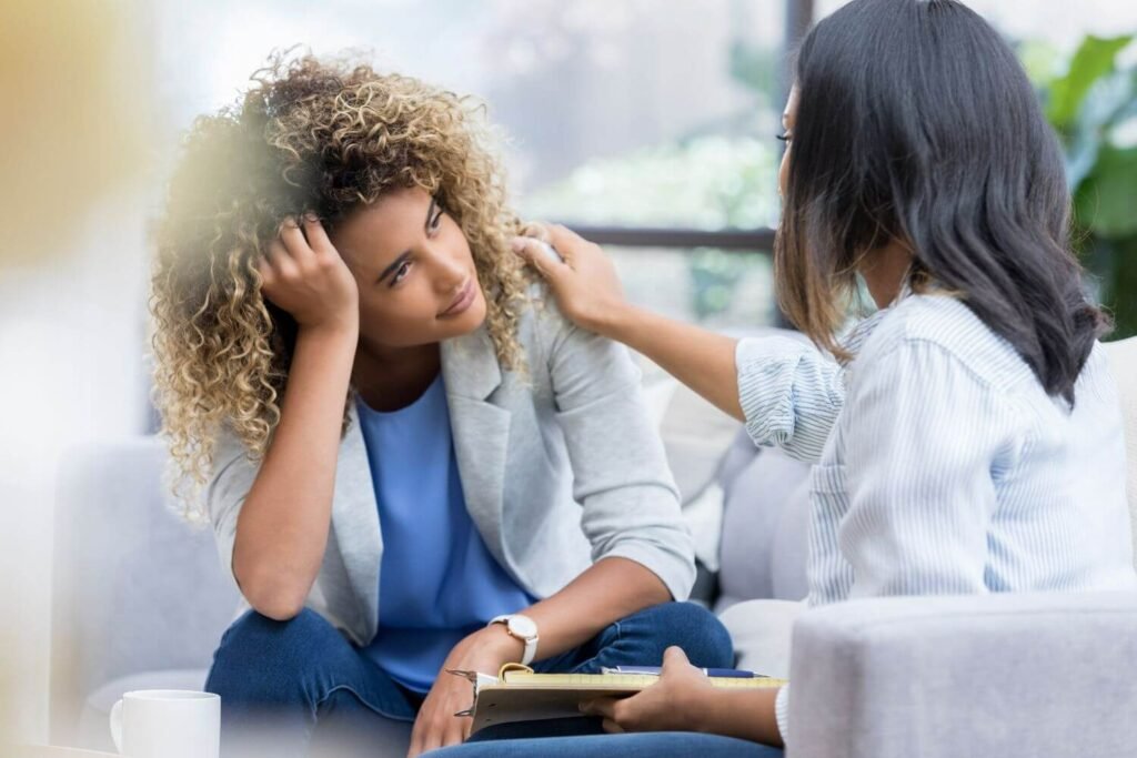 Stressed woman is in conversation with a medical provider
