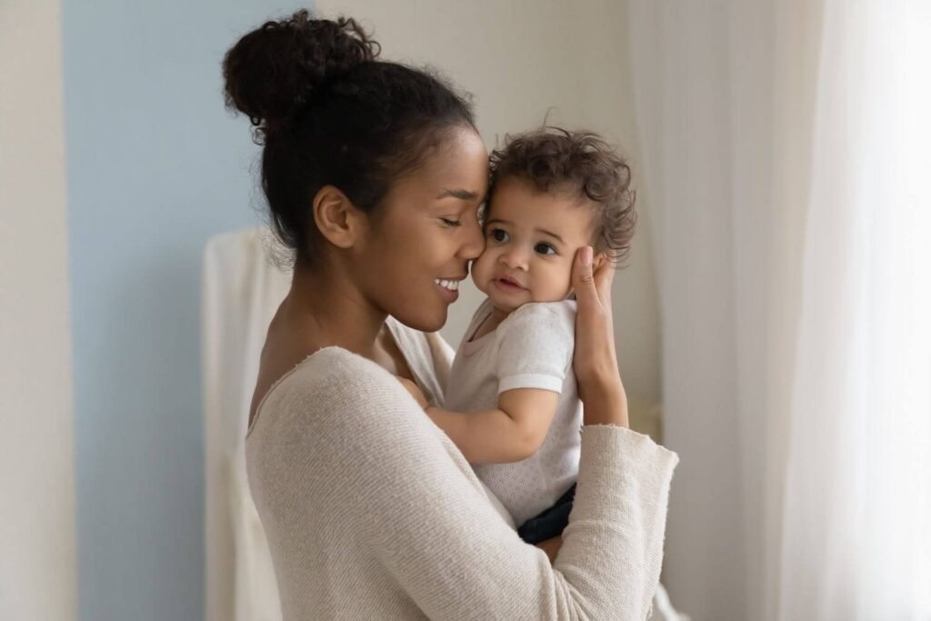 Woman lovingly holding her baby